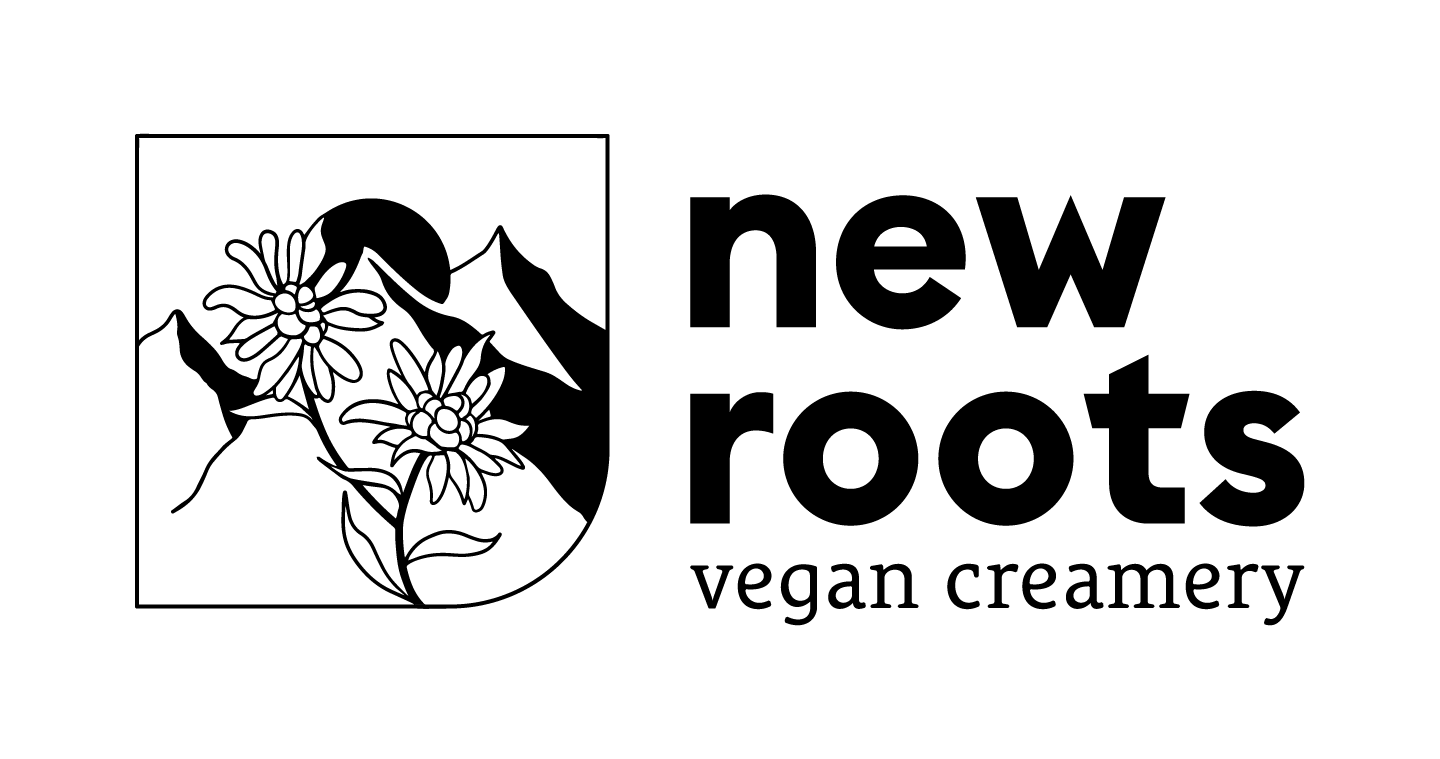 new roots logo mit Berg und Blume